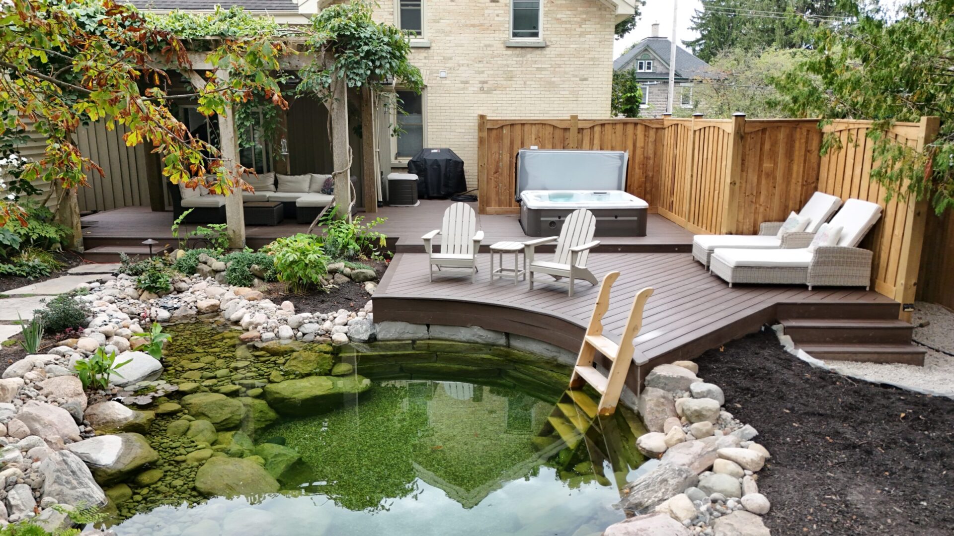 A Beautiful backyard with patio and naturally build pond 