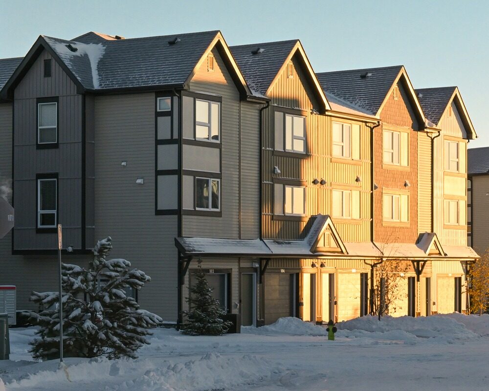 Row of townhomes on a snowy morning