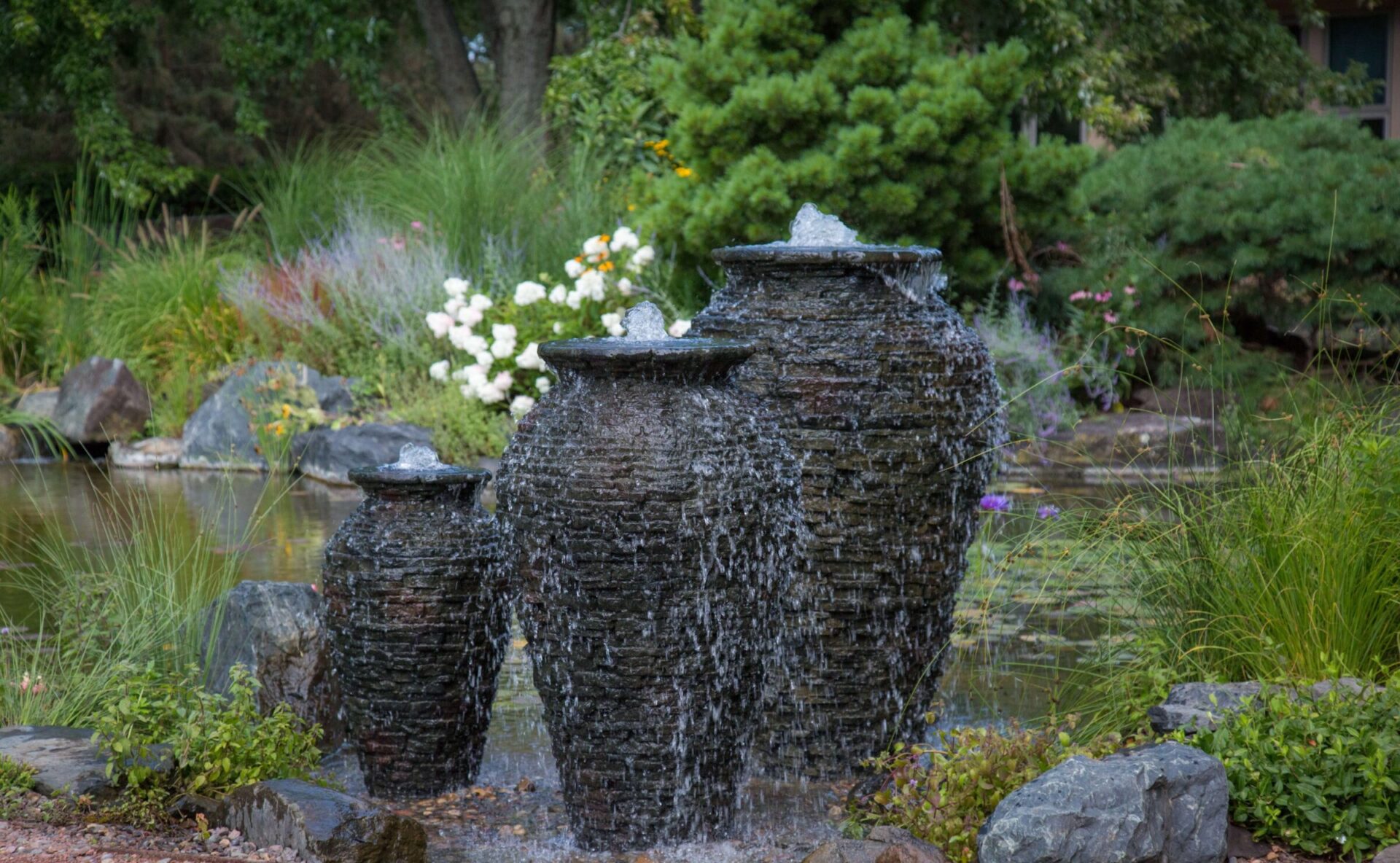 Three stacked urn water features installed by St. Jacob's Landscaping.